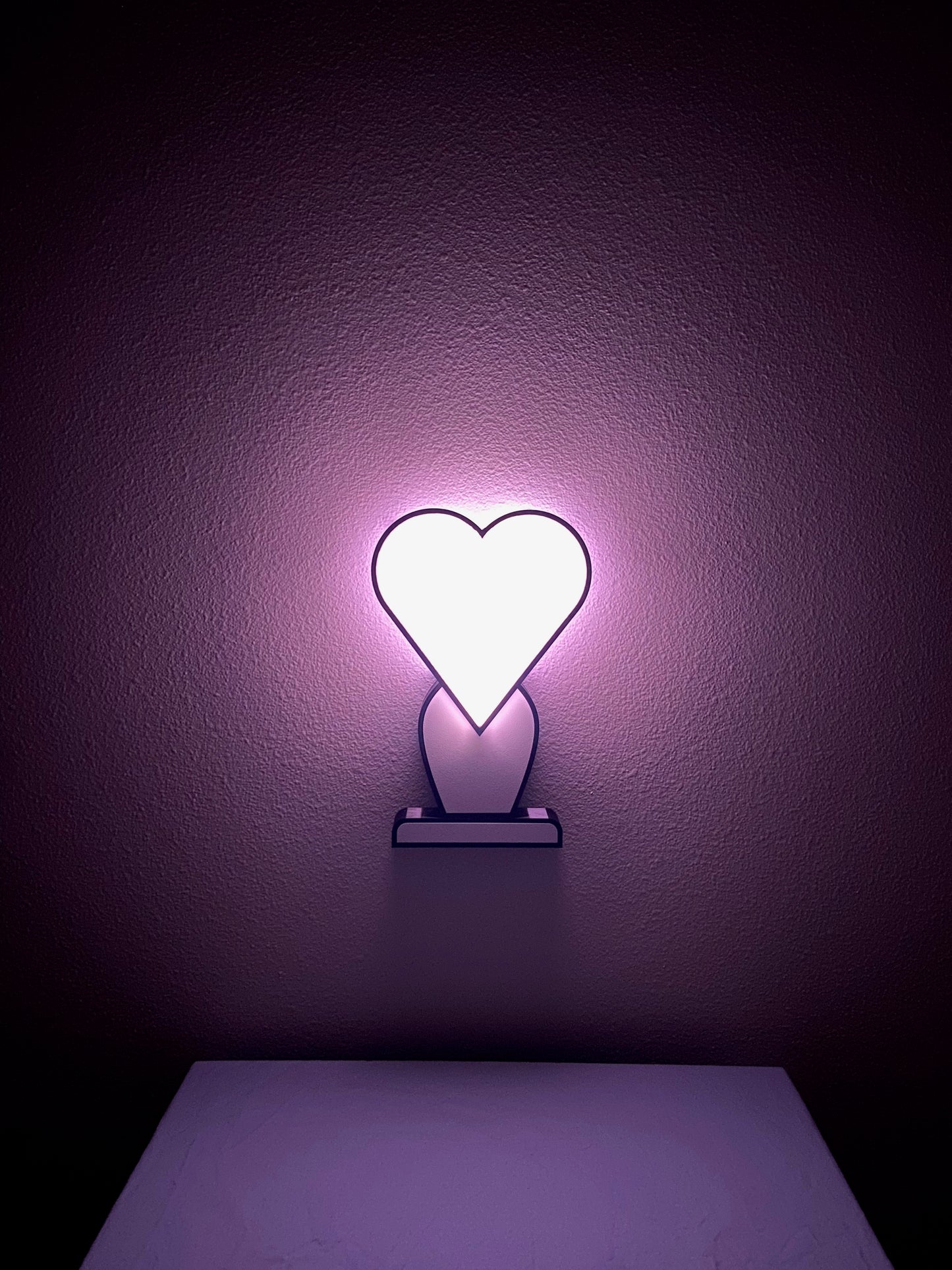 Iconic 2D Heart Lamp, White/White, on pink hue